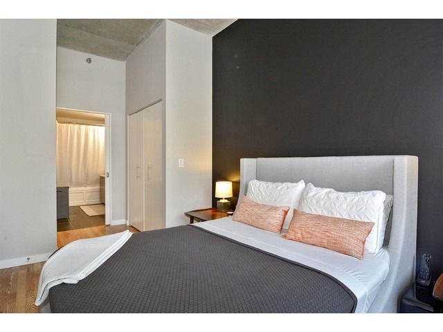 235 West Van Buren Street, Unit 1616 Chicago, IL 60607 - Photo 10 of 16 a bedroom with a bed and window
