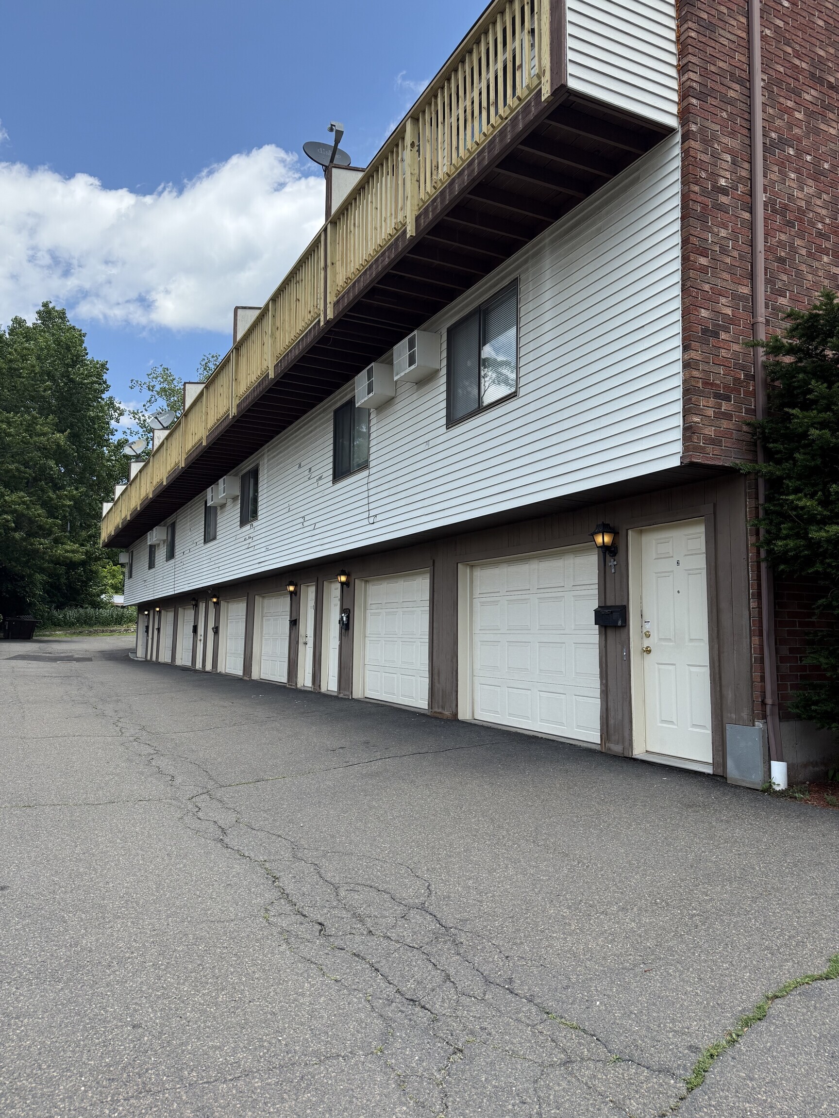 531 Meriden Road, Unit 2 Waterbury, CT 06705 - Photo 1 of 13 a view of a house with a garage
