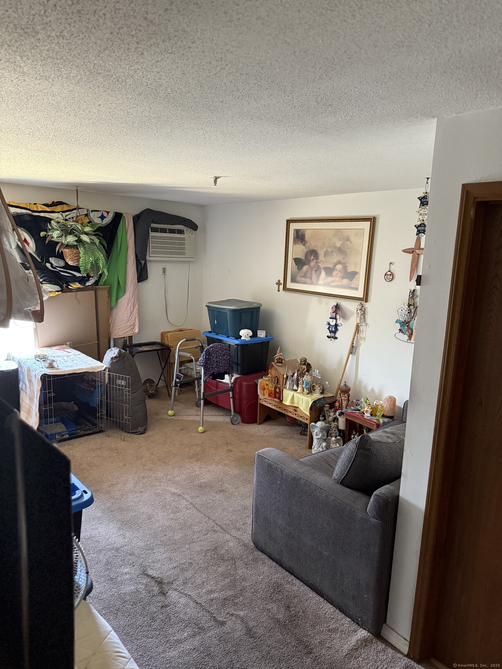 531 Meriden Road, Unit 2 Waterbury, CT 06705 - Photo 11 of 13 a living room with furniture and a flat screen tv