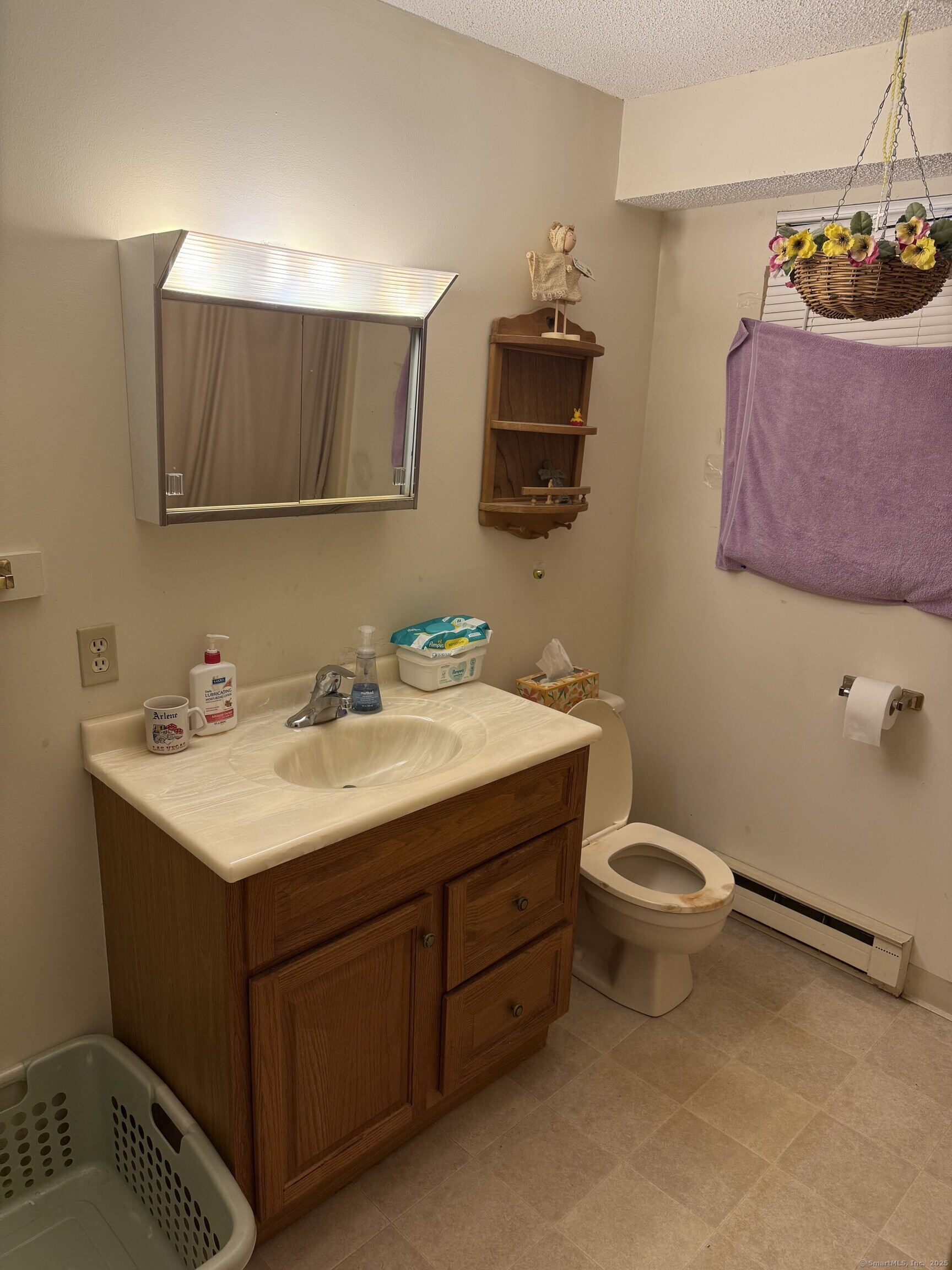 531 Meriden Road, Unit 2 Waterbury, CT 06705 - Photo 12 of 13 a bathroom with a sink toilet and mirror