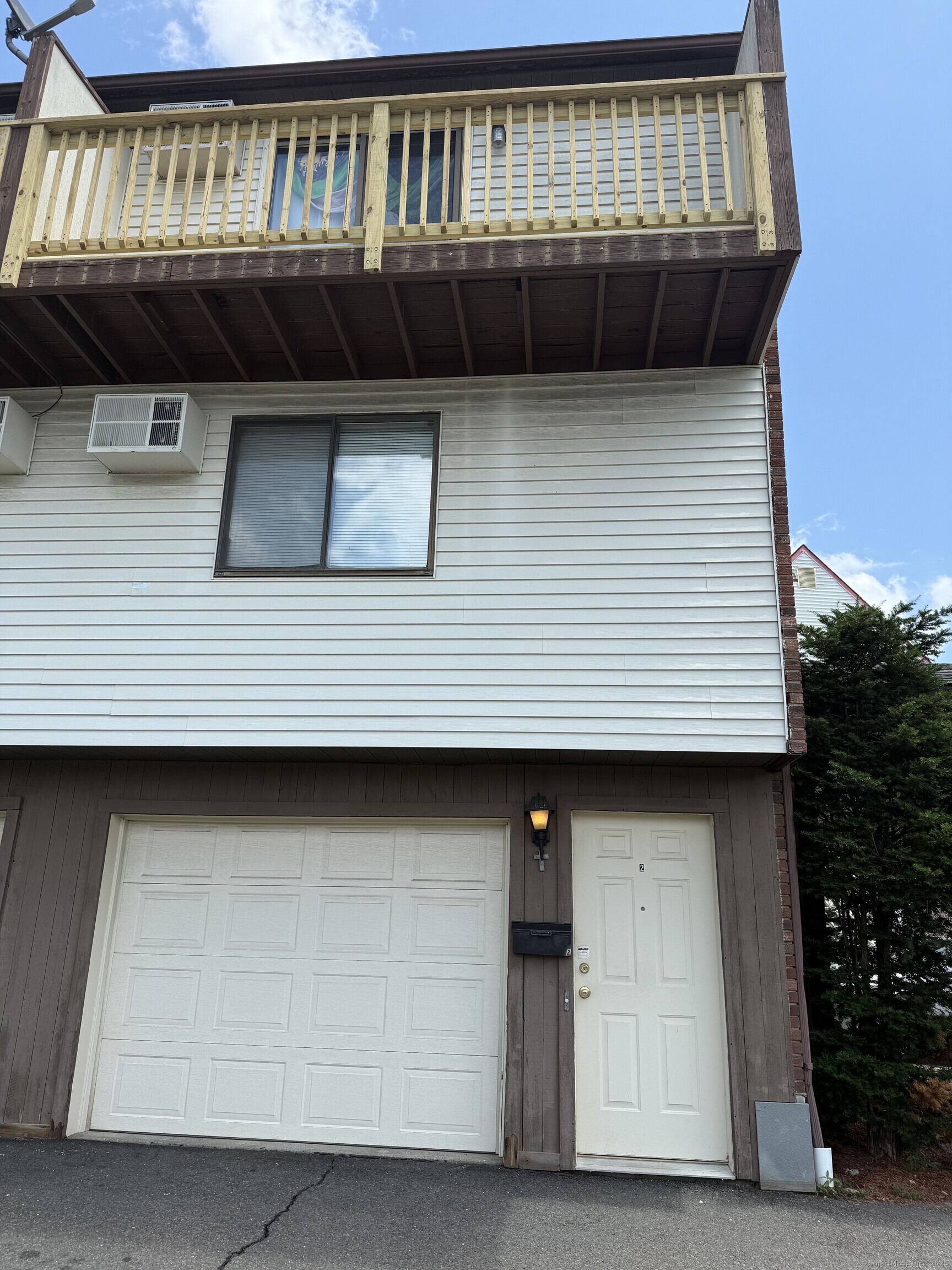 531 Meriden Road, Unit 2 Waterbury, CT 06705 - Photo 2 of 13 a front view of a house with balcony