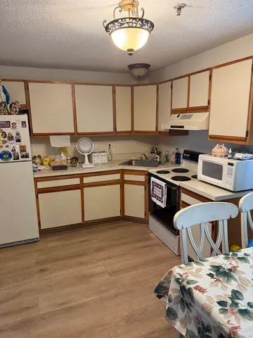 a bedroom with furniture and a lamp