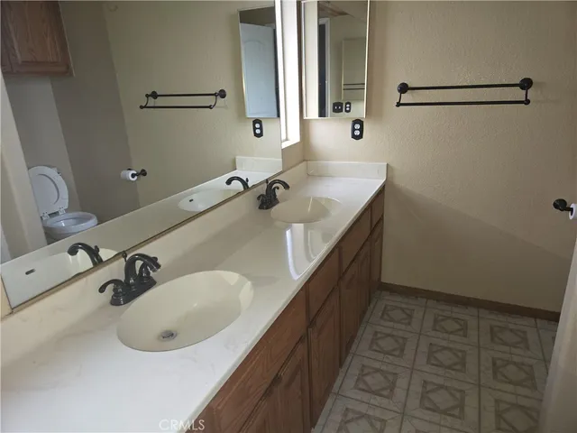 a white toilet sitting next to a shower