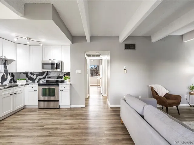 a bedroom with a bed and a night stand