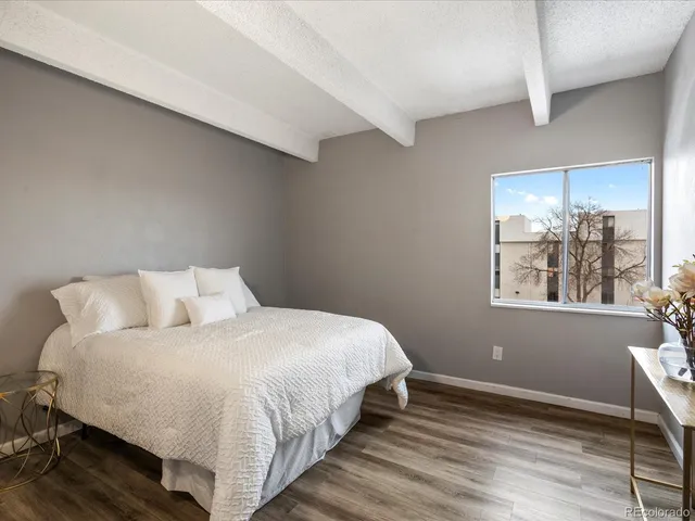 a bathroom with a sink a light fixture and a shower