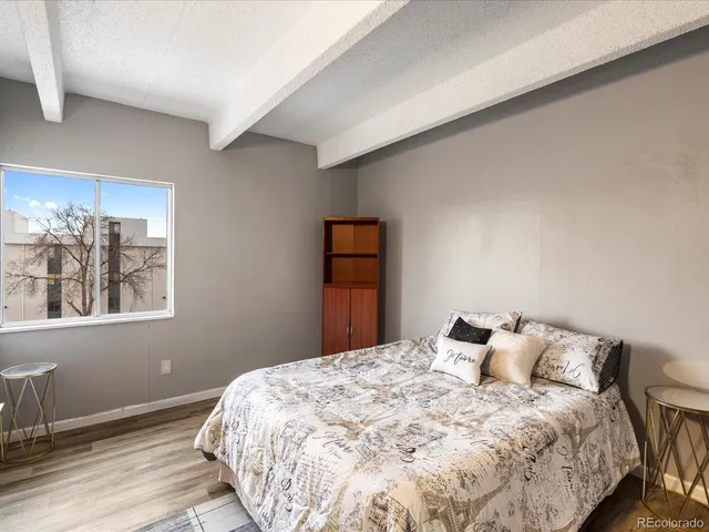 a bedroom with a bed and a dresser