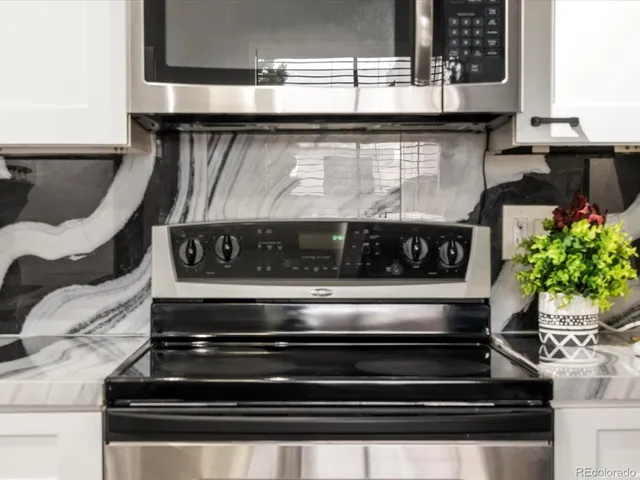 a kitchen with a sink and a refrigerator