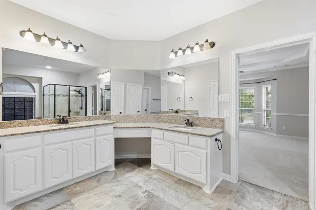 a large bathroom with a sink and a mirror