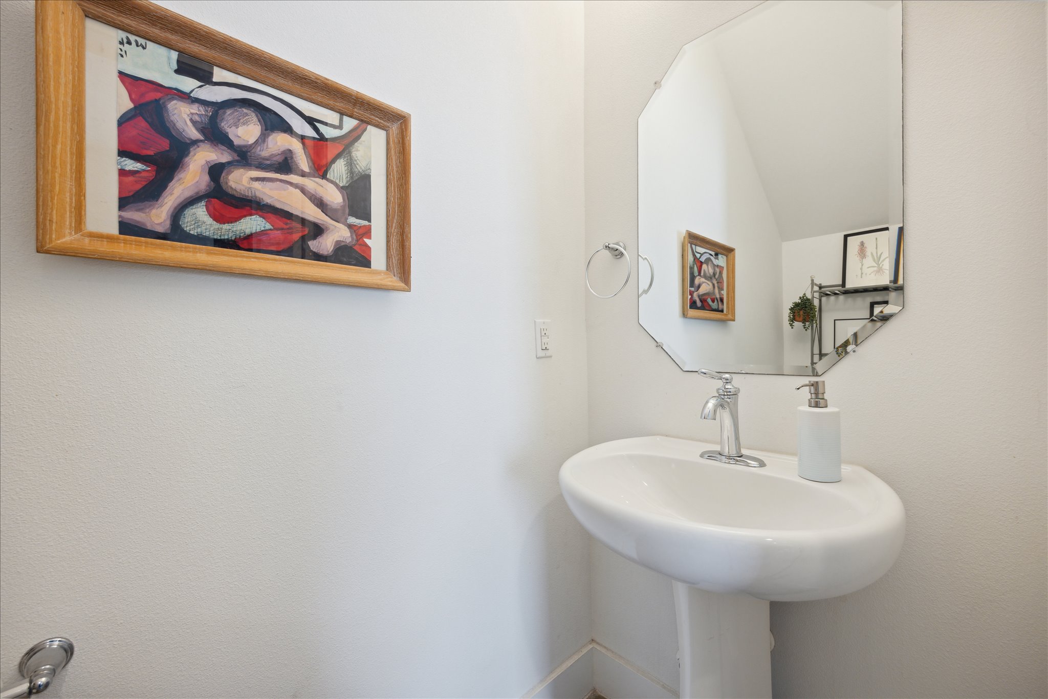 5006 Baker Street, Unit B Austin, TX 78721 - Photo 9 of 16 a bathroom with a sink and a mirror