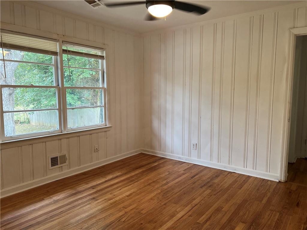 1215 Westview Drive Southwest, Unit A Atlanta, GA 30310 - Photo 18 of 25 a view of an empty room with wooden floor and a window