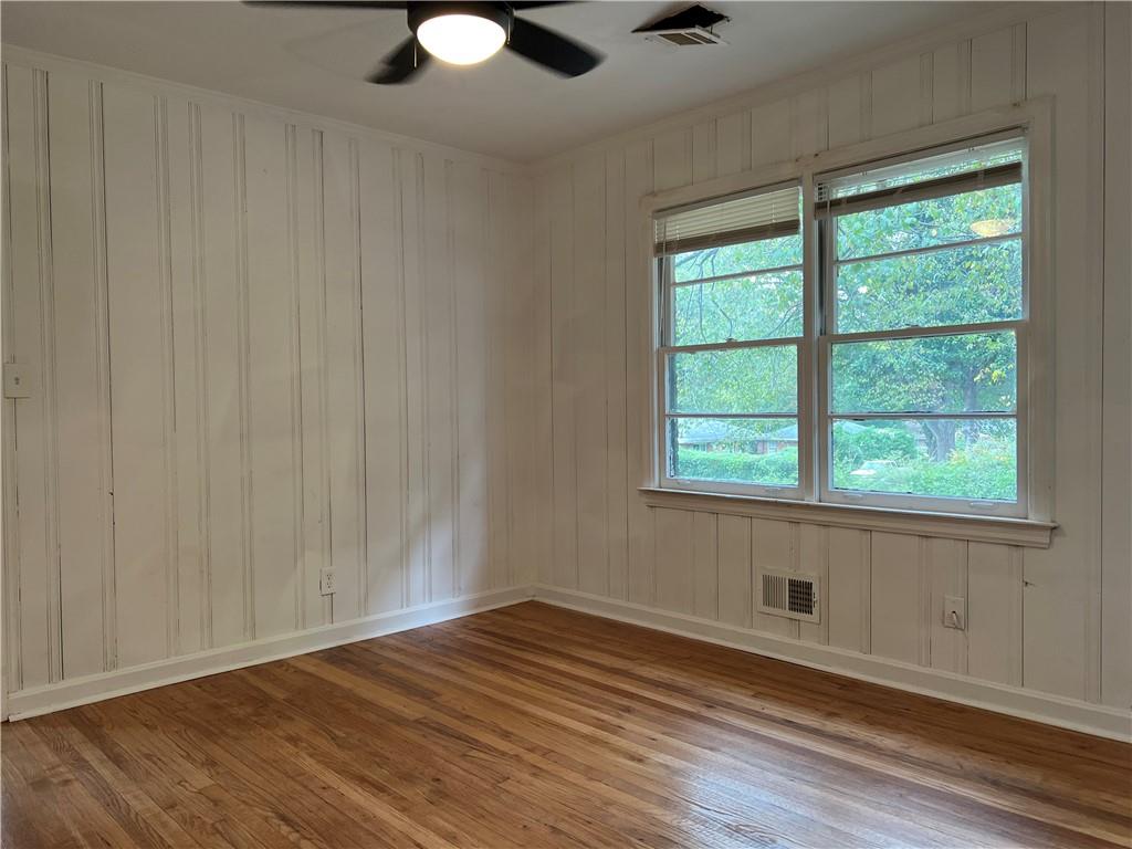 1215 Westview Drive Southwest, Unit A Atlanta, GA 30310 - Photo 19 of 25 a view of an empty room with wooden floor and a window