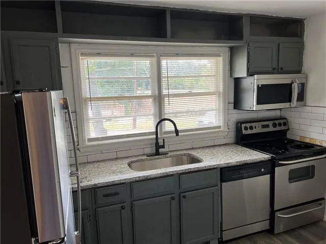 a utility room with washer and dryer