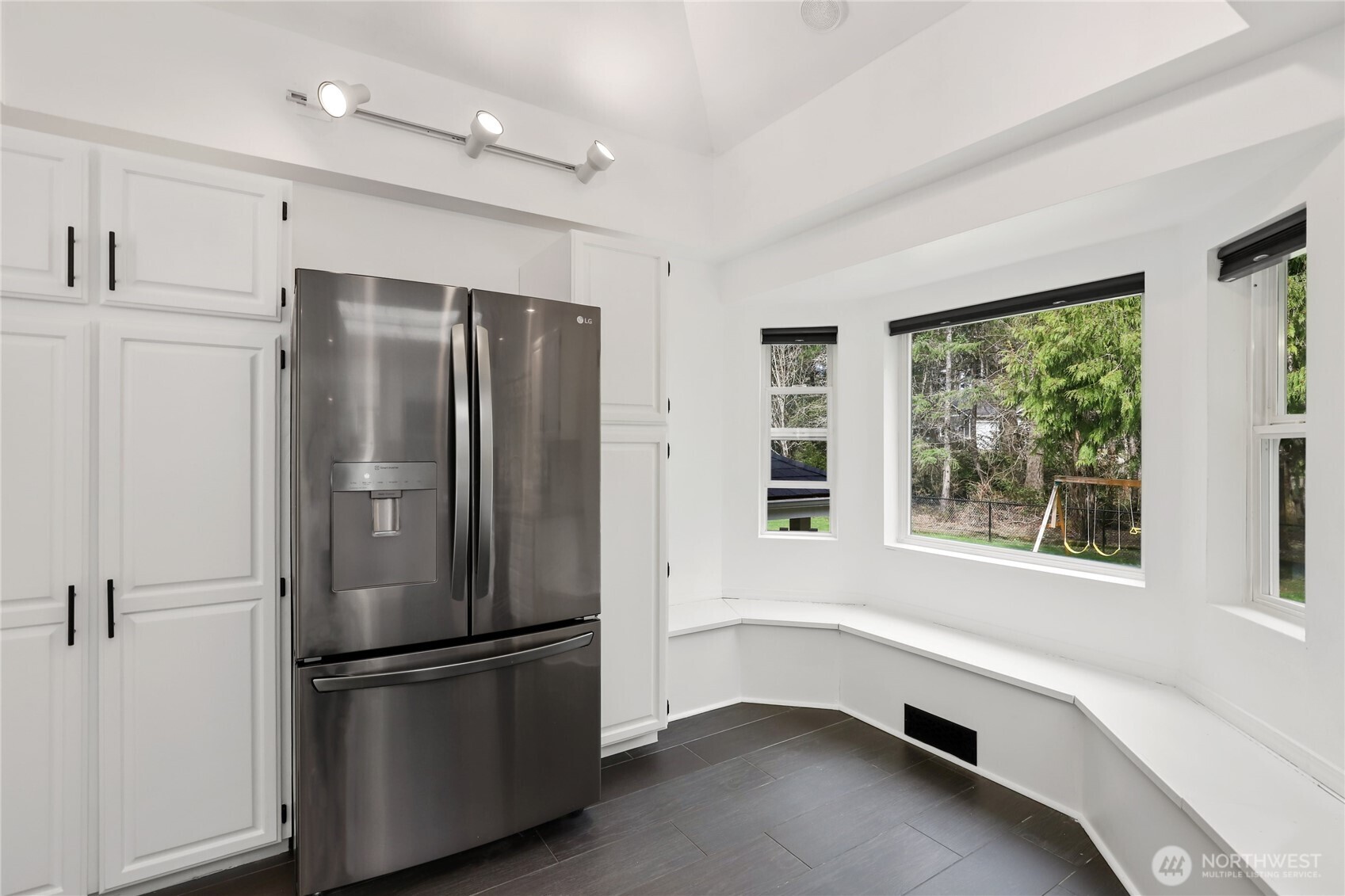 1063 Southwest Depot Court Port Orchard, WA 98367 - Photo 11 of 40 a kitchen with stainless steel appliances a refrigerator and a window