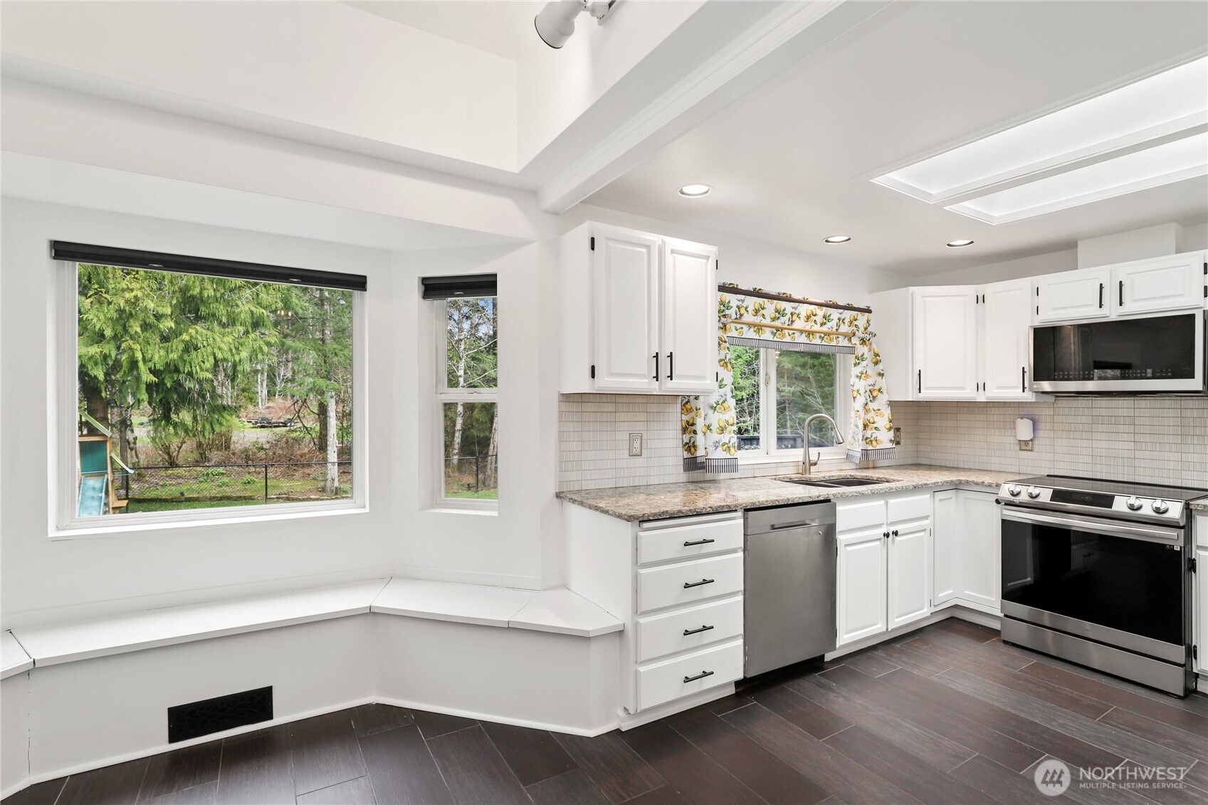 1063 Southwest Depot Court Port Orchard, WA 98367 - Photo 12 of 40 a kitchen with stainless steel appliances granite countertop a stove and a sink