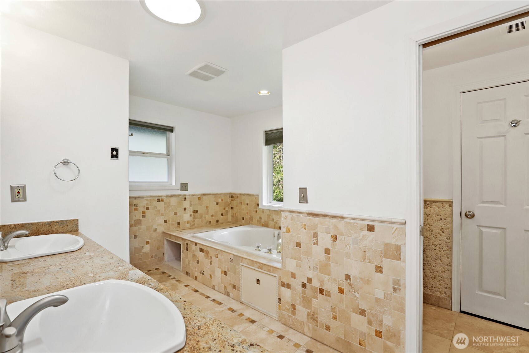 1063 Southwest Depot Court Port Orchard, WA 98367 - Photo 17 of 40 a bathroom with a granite countertop sink and a mirror