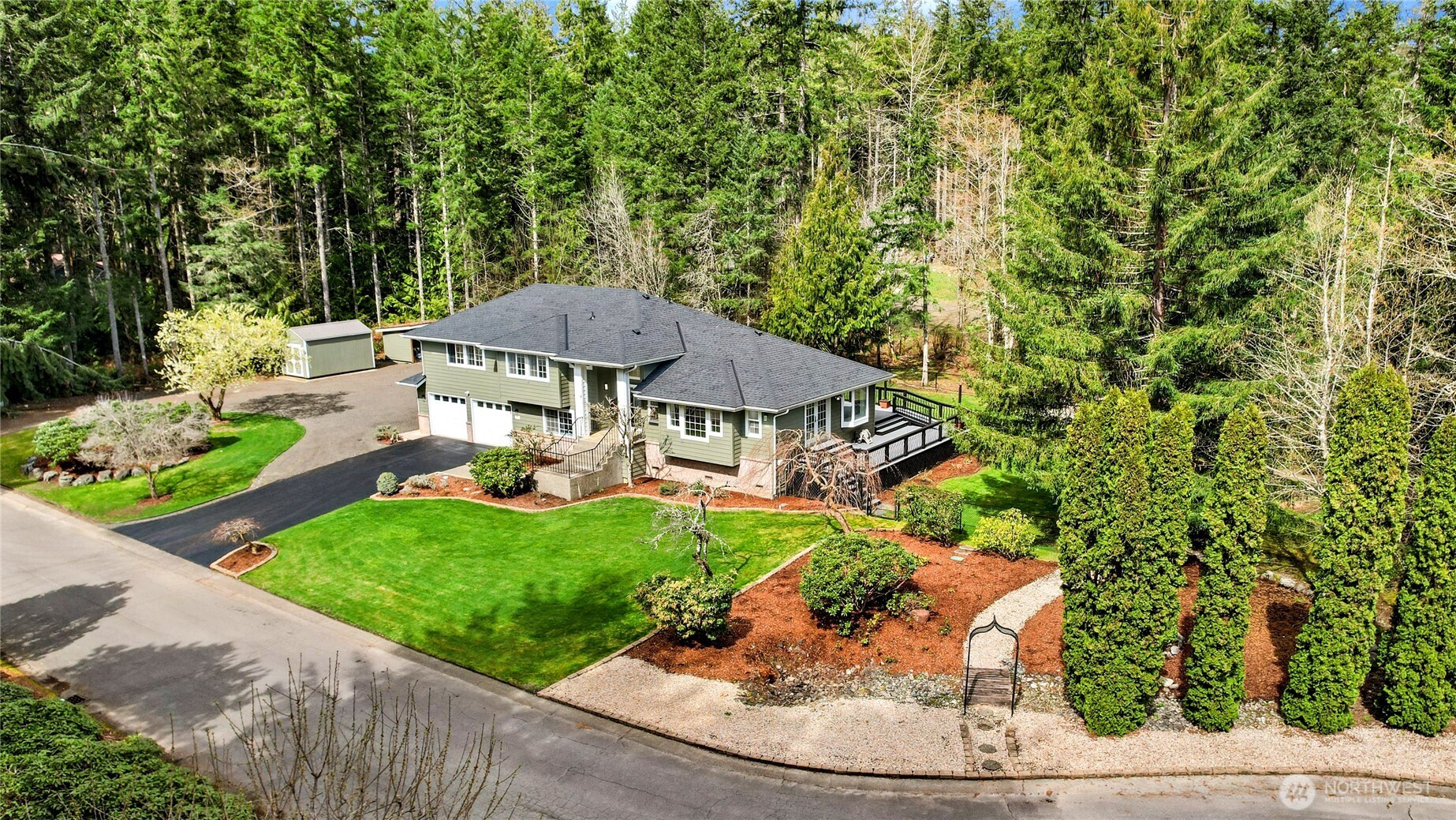 1063 Southwest Depot Court Port Orchard, WA 98367 - Photo 2 of 40 a view of a garden with an outdoor space