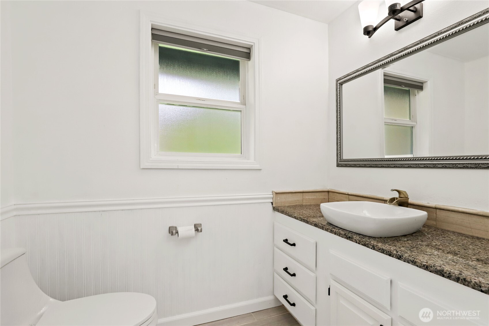1063 Southwest Depot Court Port Orchard, WA 98367 - Photo 24 of 40 a bathroom with a granite countertop toilet sink and mirror