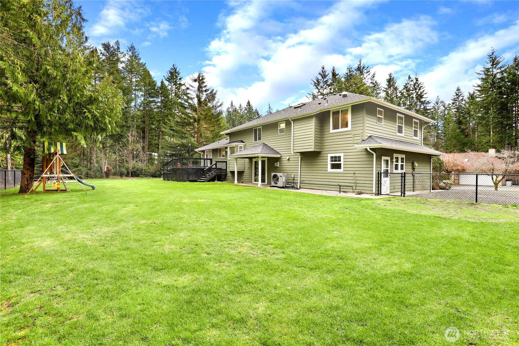 1063 Southwest Depot Court Port Orchard, WA 98367 - Photo 33 of 40 a view of a house with a big yard and large trees