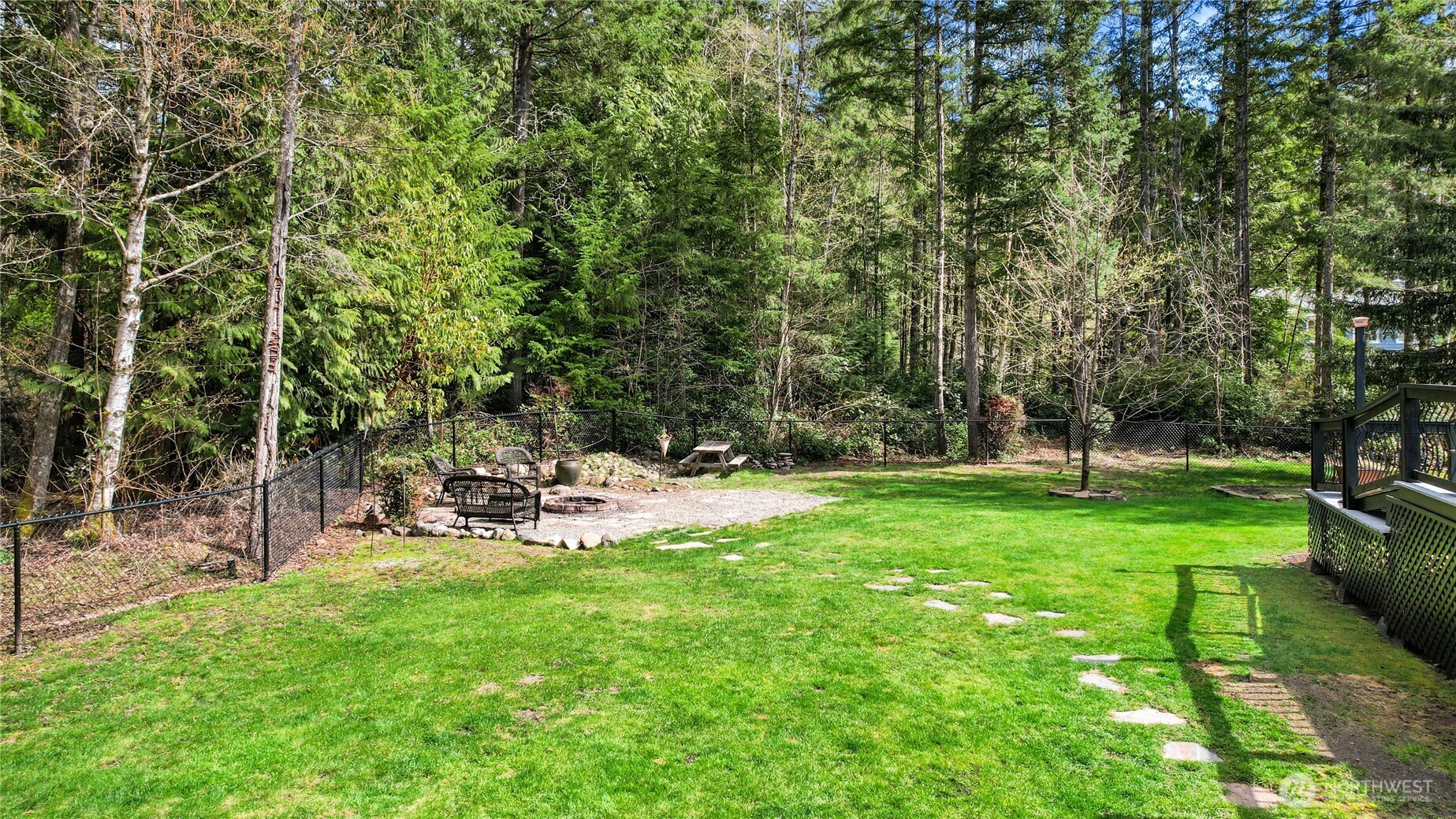 1063 Southwest Depot Court Port Orchard, WA 98367 - Photo 34 of 40 a view of a backyard with a garden and trees