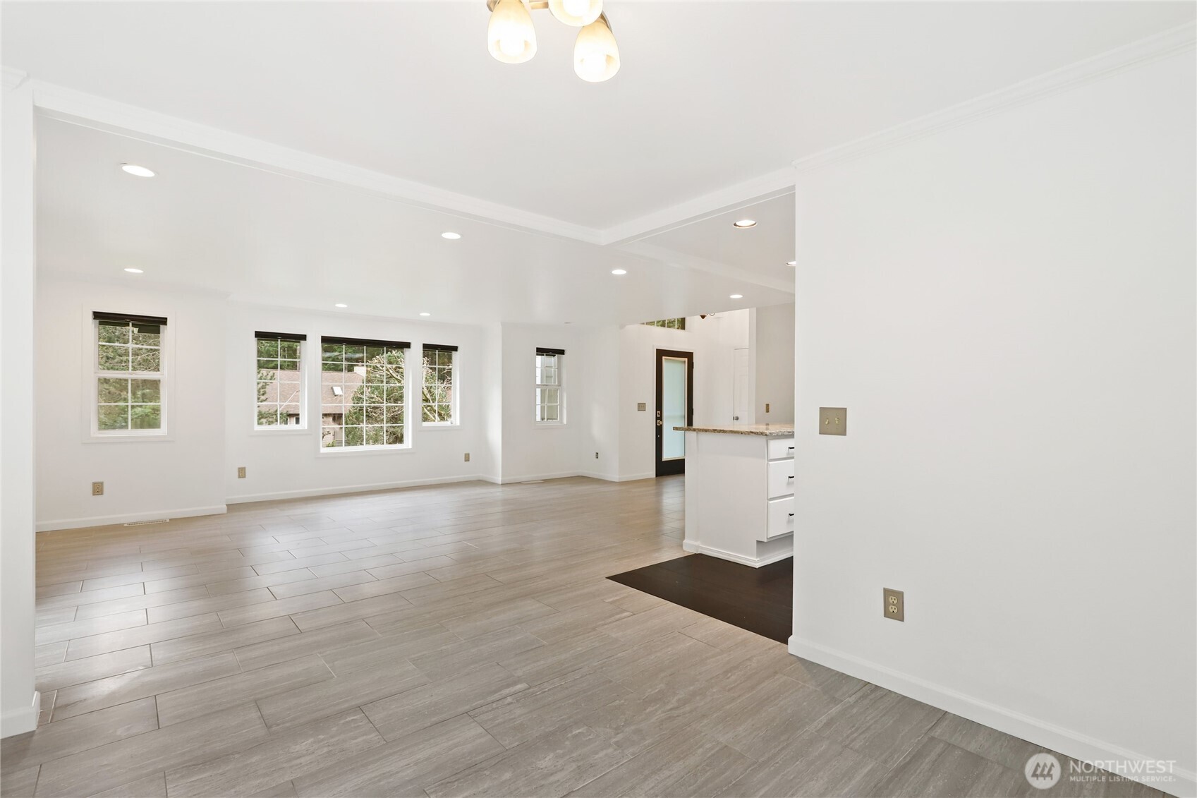 1063 Southwest Depot Court Port Orchard, WA 98367 - Photo 6 of 40 an empty room with wooden floor and windows