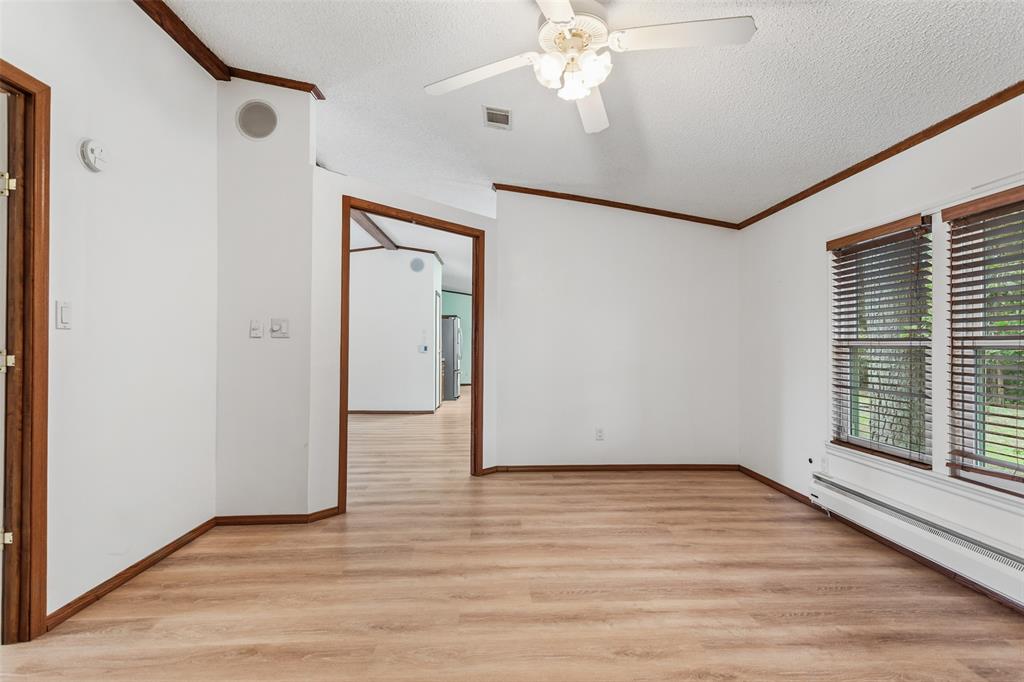 7398 County Road 334 Tyler, TX 75708 - Photo 23 of 39 Coming out of Primary Bedroom Leading to Main Living Area Dining and Kitchen