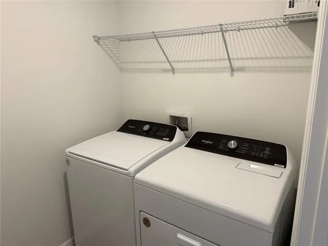 a utility room with dryer and washer