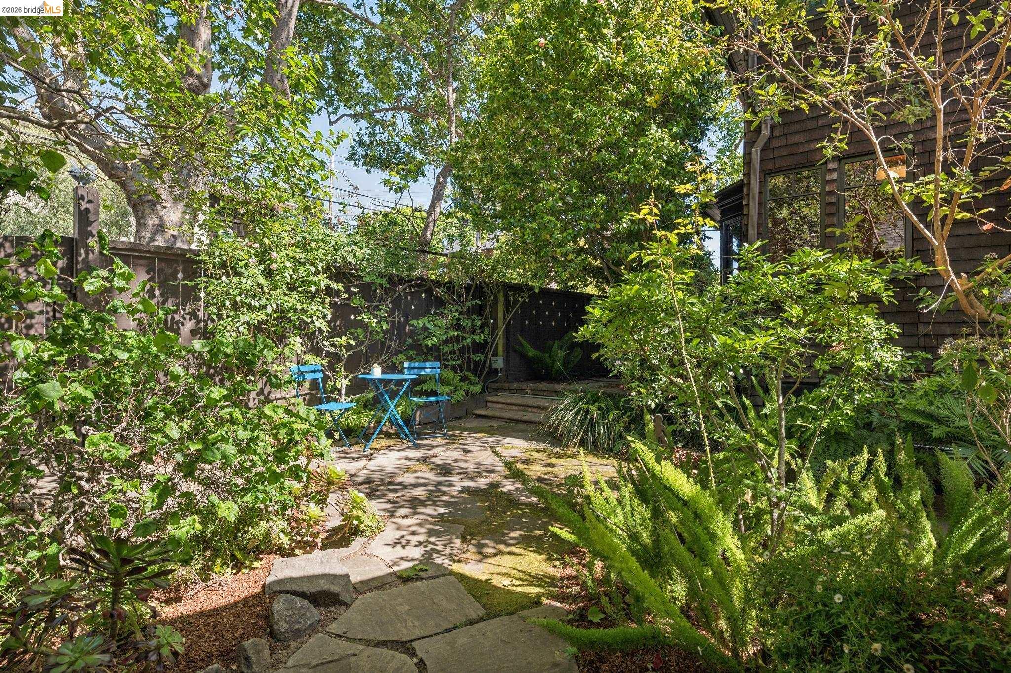 1490 Arch Street Berkeley, CA 94708 - Photo 48 of 57 a backyard of a house with table and chairs