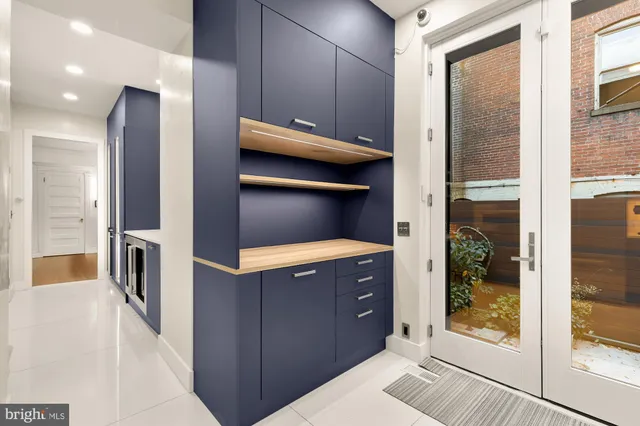 a kitchen with a wooden cabinets and a counter top space