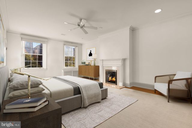 a bed room with a bed and a chair