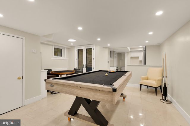 a kitchen with a table and chairs in it