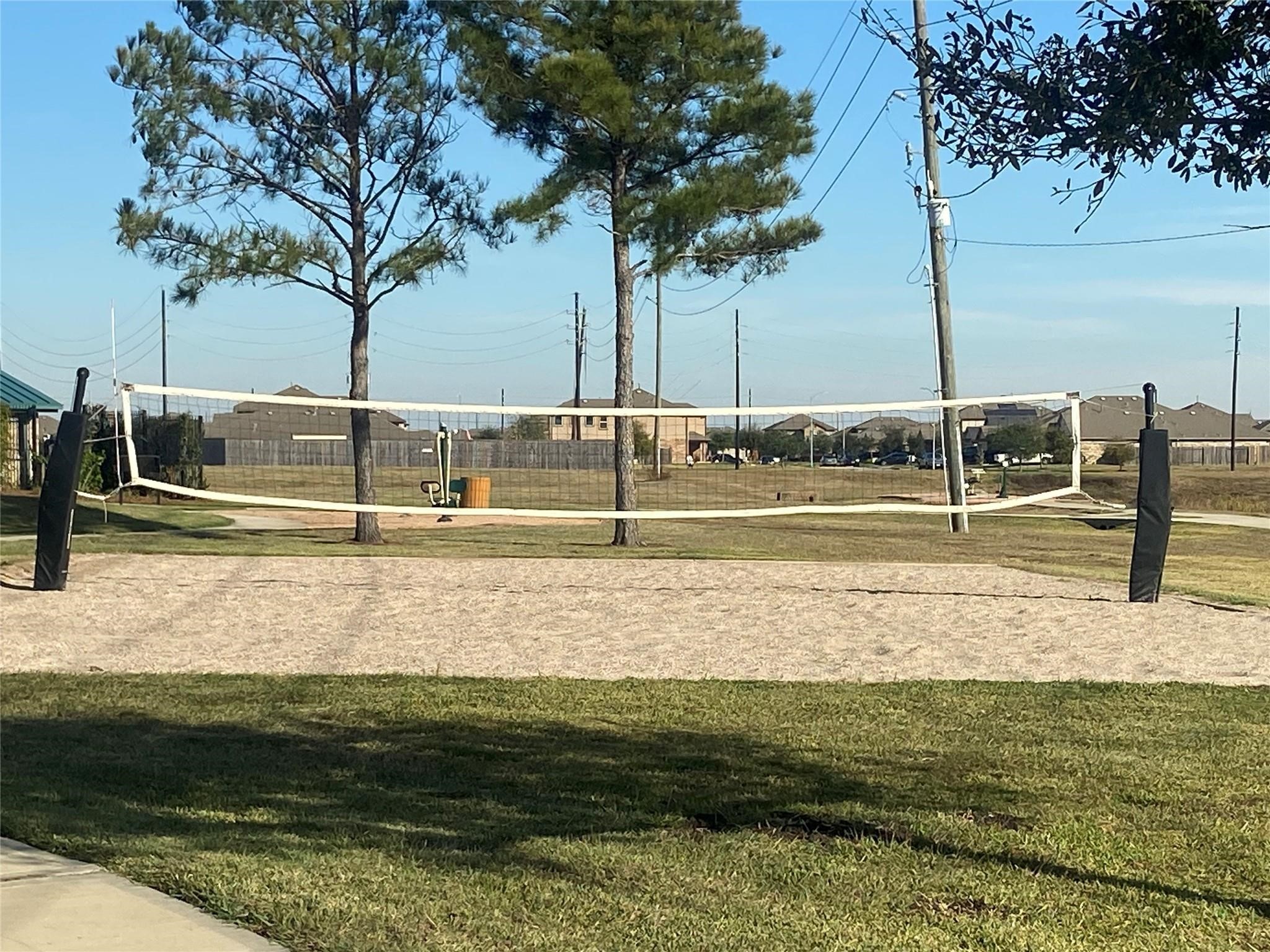 8310 Rose Petals Lane Rosharon, TX 77583 - Photo 37 of 37 Community sand volleyball court in Southern Colony, offering a fun recreational space for residents to enjoy outdoor sports and gatherings. Surrounded by open green areas and walking paths, this park feature provides a great place for friendly games and neighborhood activities.