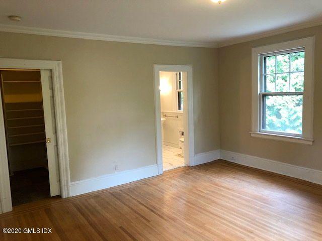 5 Brookridge Drive Greenwich, CT 06830 - Photo 13 of 17 a view of an empty room with wooden floor and a window