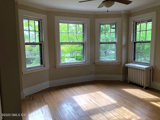 5 Brookridge Drive Greenwich, CT 06830 - Photo 15 of 17 a view of an empty room with a window and wooden floor