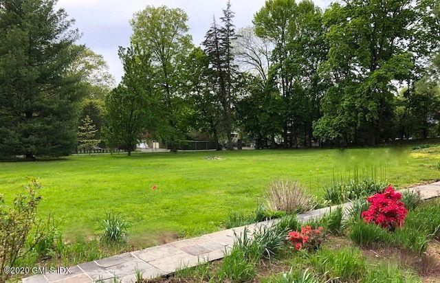 5 Brookridge Drive Greenwich, CT 06830 - Photo 3 of 17 a view of a garden with plants and large trees