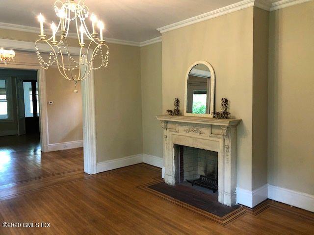 5 Brookridge Drive Greenwich, CT 06830 - Photo 6 of 17 a view of a livingroom with a fireplace wooden floor and a fireplace