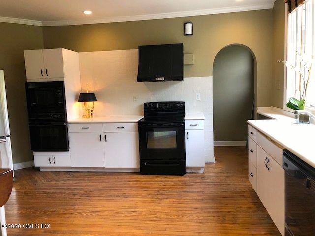 5 Brookridge Drive Greenwich, CT 06830 - Photo 8 of 17 a kitchen with stainless steel appliances kitchen island granite countertop a stove a sink and a refrigerator