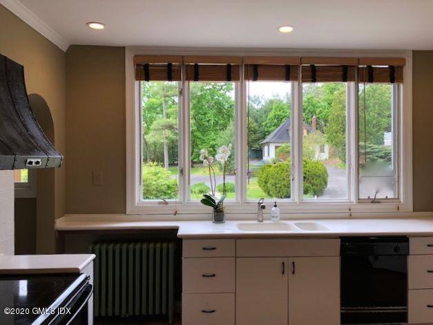 5 Brookridge Drive Greenwich, CT 06830 - Photo 9 of 17 a kitchen with large windows and sink