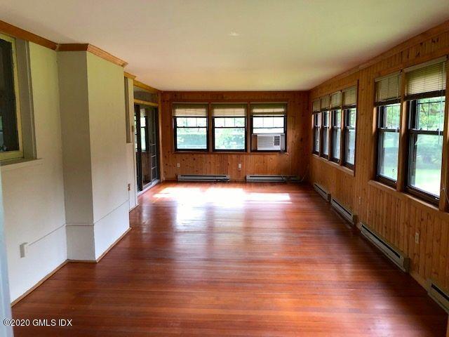 5 Brookridge Drive Greenwich, CT 06830 - Photo 10 of 17 a view of an empty room with wooden floor and a window