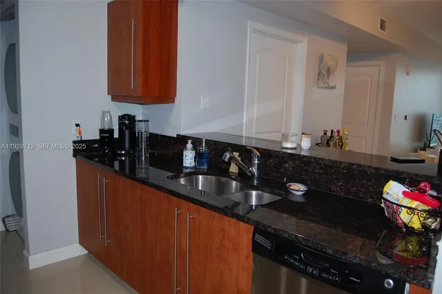 a kitchen with a sink and cabinets