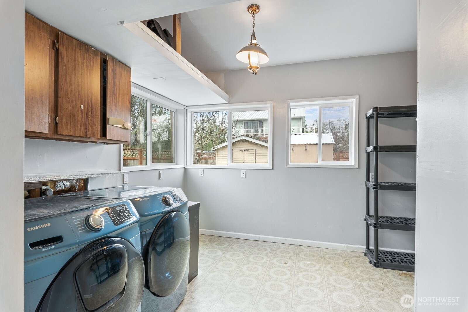 1705 36th Street Anacortes, WA 98221 - Photo 12 of 39 a view of workspace with stainless steel appliances wooden floor and windows