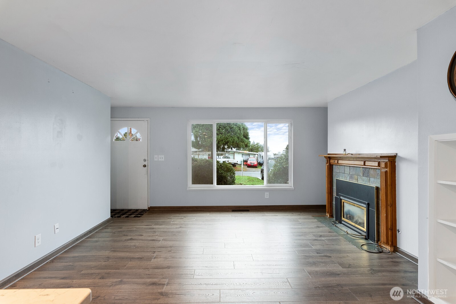 1705 36th Street Anacortes, WA 98221 - Photo 25 of 39 an empty room with wooden floor and windows