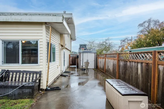a view of a deck with chair and wooden floor