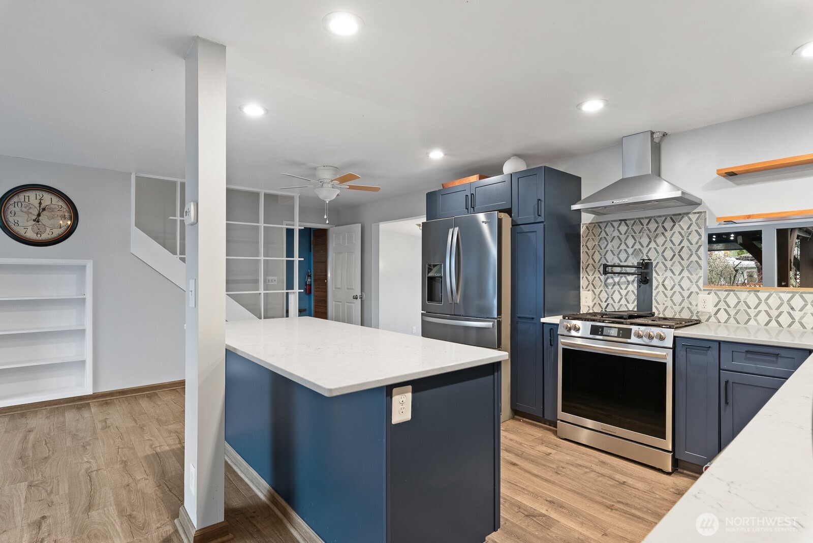1705 36th Street Anacortes, WA 98221 - Photo 5 of 39 a kitchen with granite countertop a stove oven and refrigerator