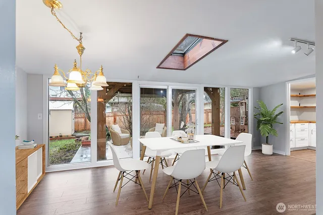 a view of a dining room with furniture window and wooden floor
