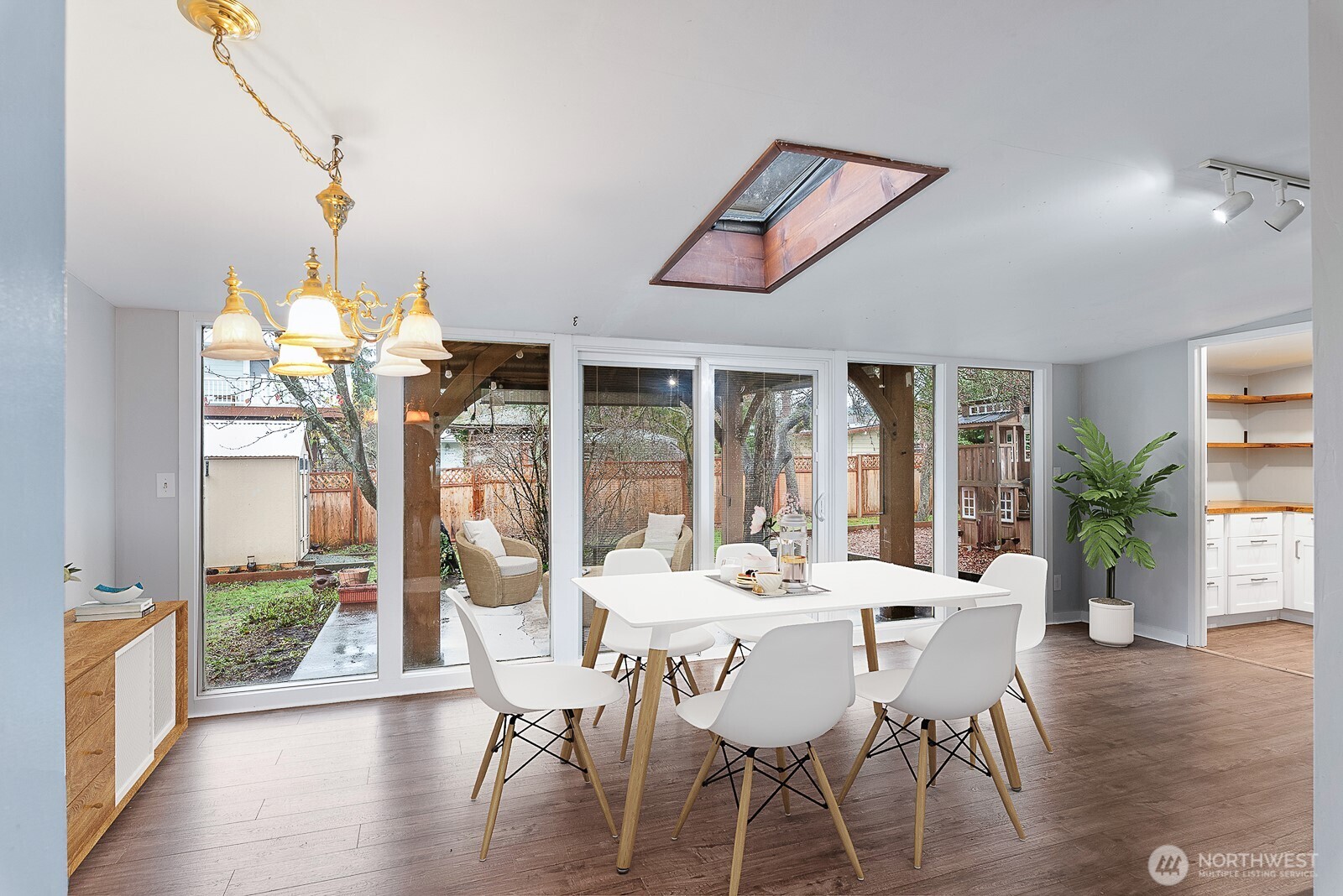 1705 36th Street Anacortes, WA 98221 - Photo 7 of 39 a view of a dining room with furniture window and wooden floor