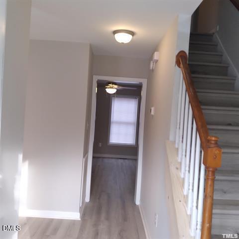 1015 Holmes Street Raleigh, NC 27601 - Photo 7 of 12 a view of a hallway with wooden floor