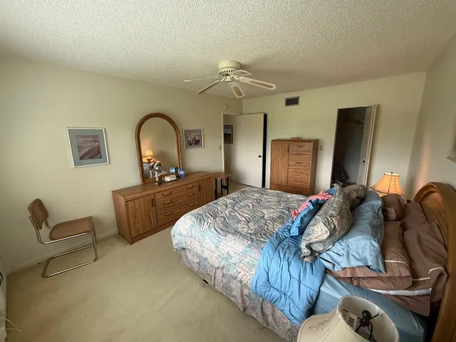 a bedroom with bed and window