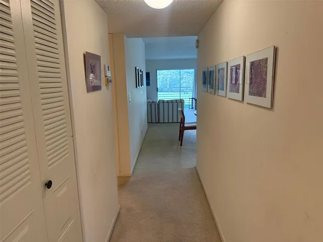 a view of a hallway with windows