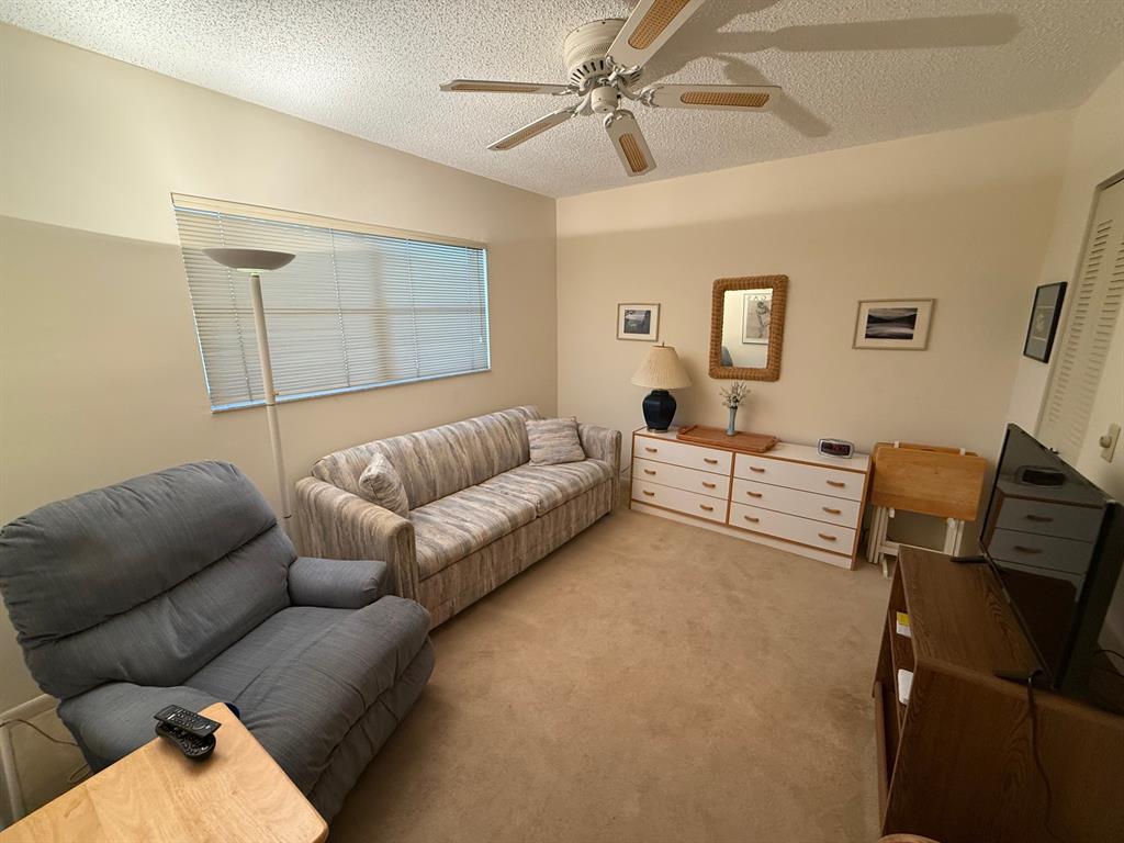 8405 Northwest 61st Street, Unit D315 Tamarac, FL 33321 - Photo 16 of 26 a living room with furniture