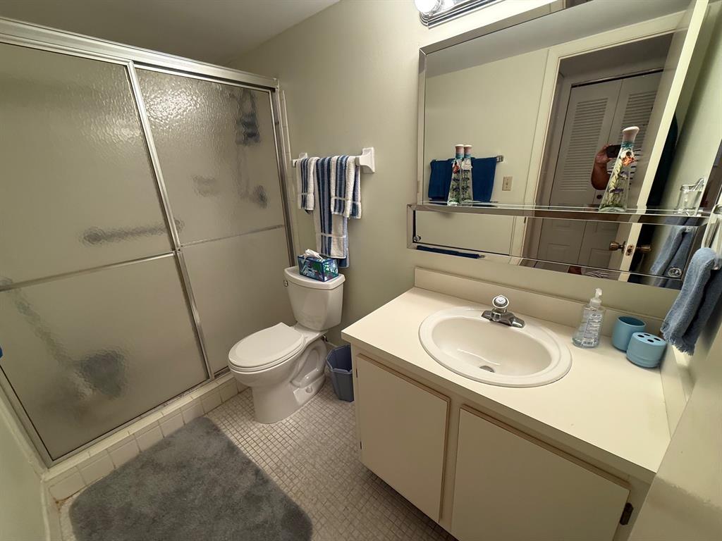 8405 Northwest 61st Street, Unit D315 Tamarac, FL 33321 - Photo 18 of 26 a bathroom with a sink toilet and shower